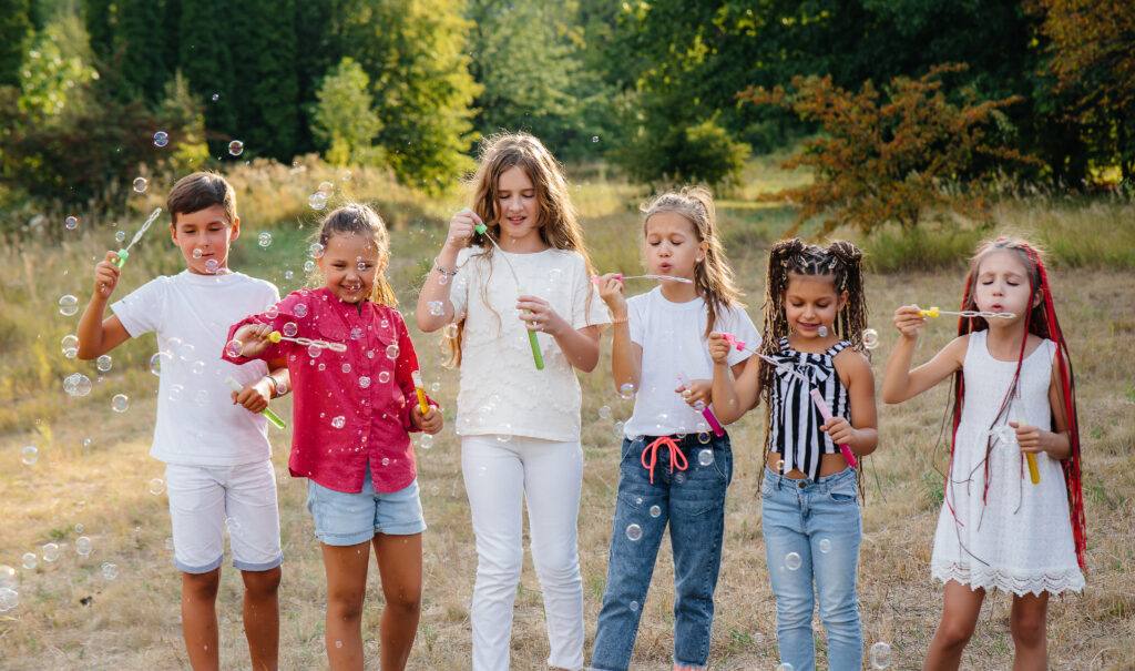 kids blowing bubbles having fun, Beautiful Moms Blog